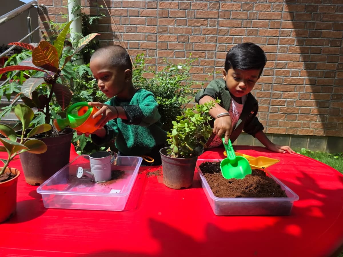 Children gardening at FlyHigh Pre School