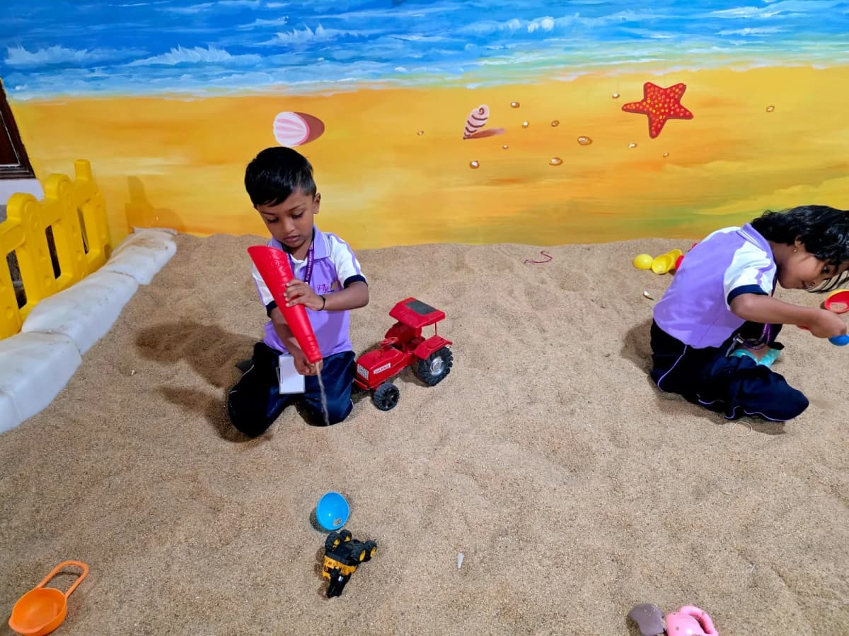 Children playing in the sand pit at FlyHigh