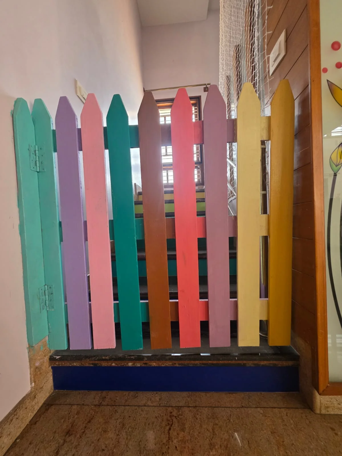 Child-safe wooden gate and safety net at the staircase, FlyHigh Pre School